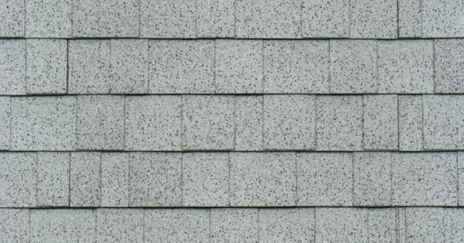 Rows of gray asphalt shingles with a textured surface pattern.